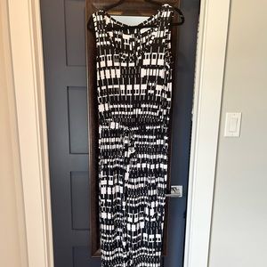 One piece jumpsuit with drawstring waist and back zipper. Worn only once.